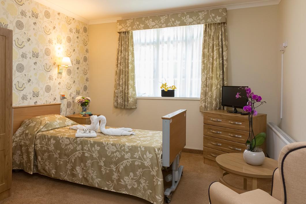 bedroom decorated with yellow floral textiles