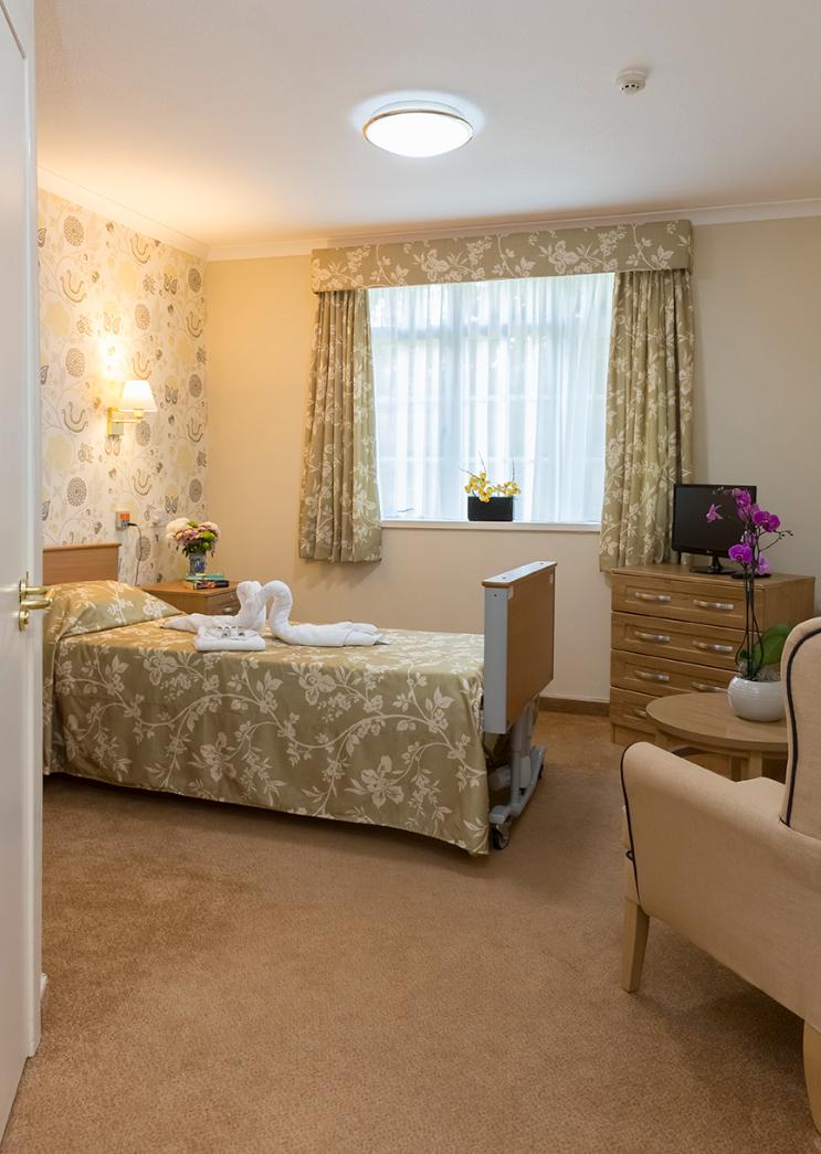 bedroom decorated with floral yellow textiles