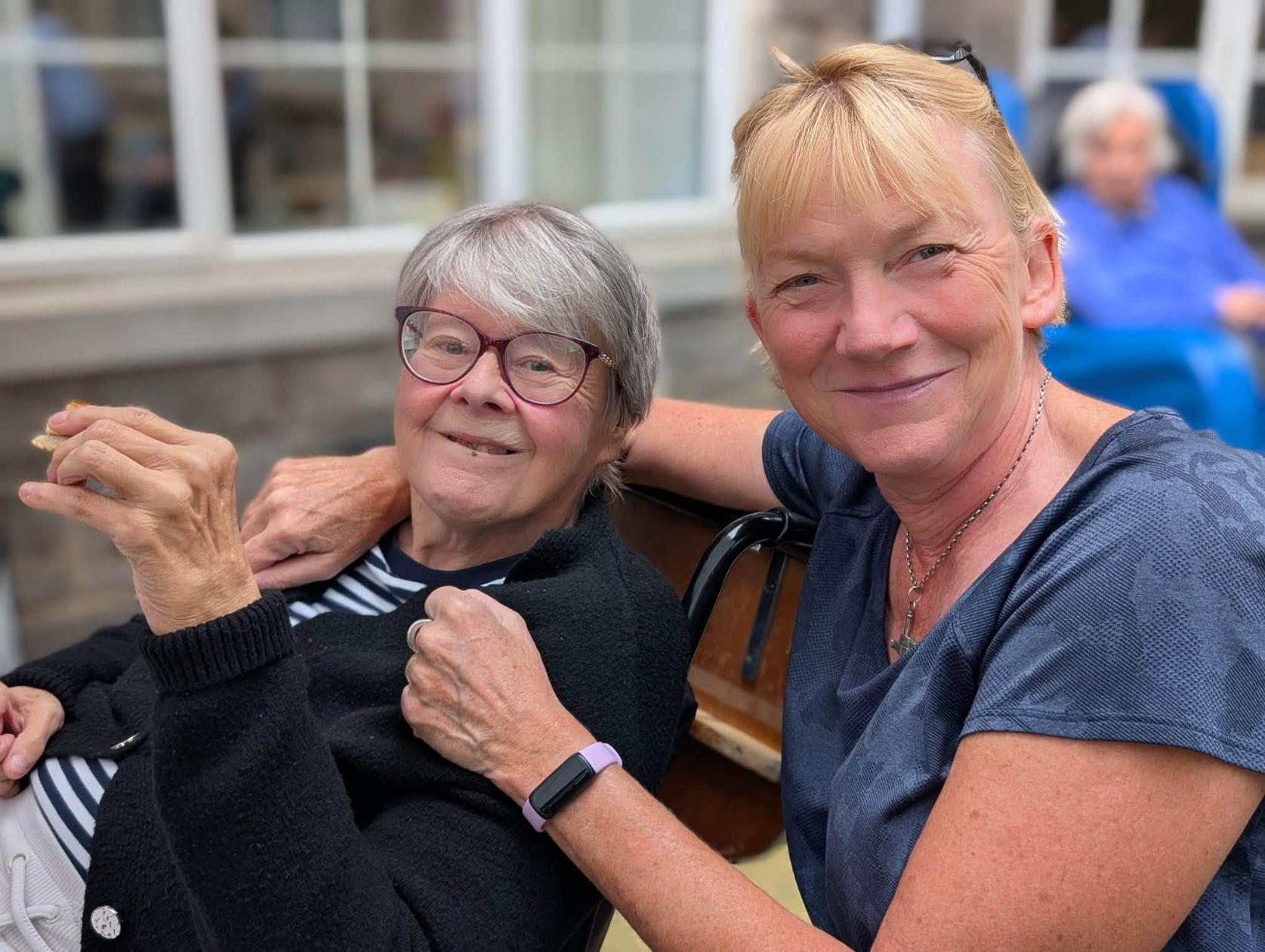 resident and family member smiling